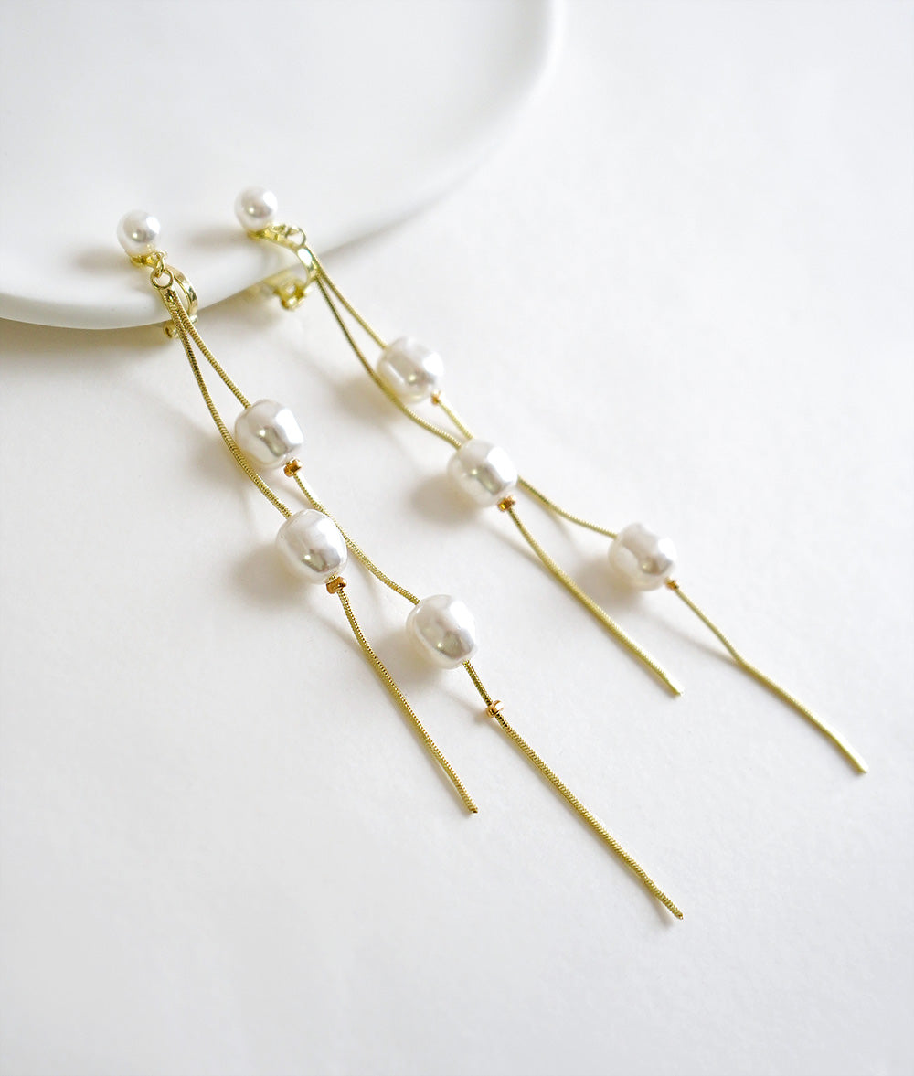 Dangling pearl earrings