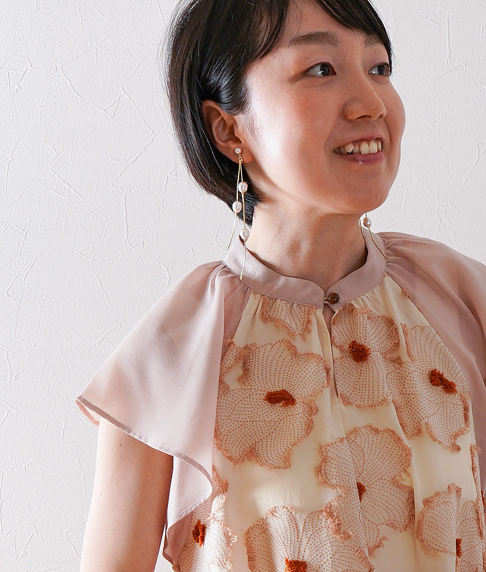 Dangling pearl earrings