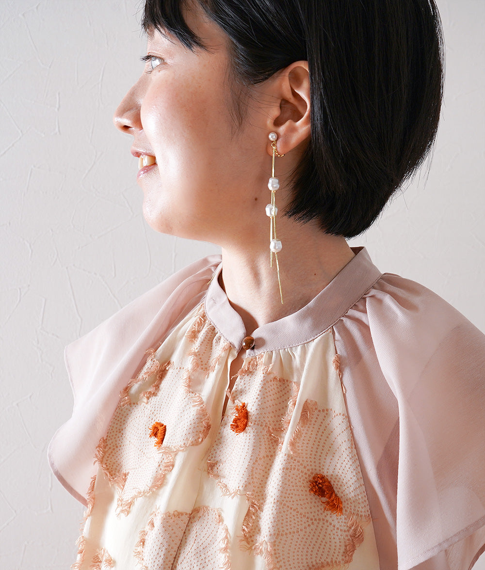 Dangling pearl earrings