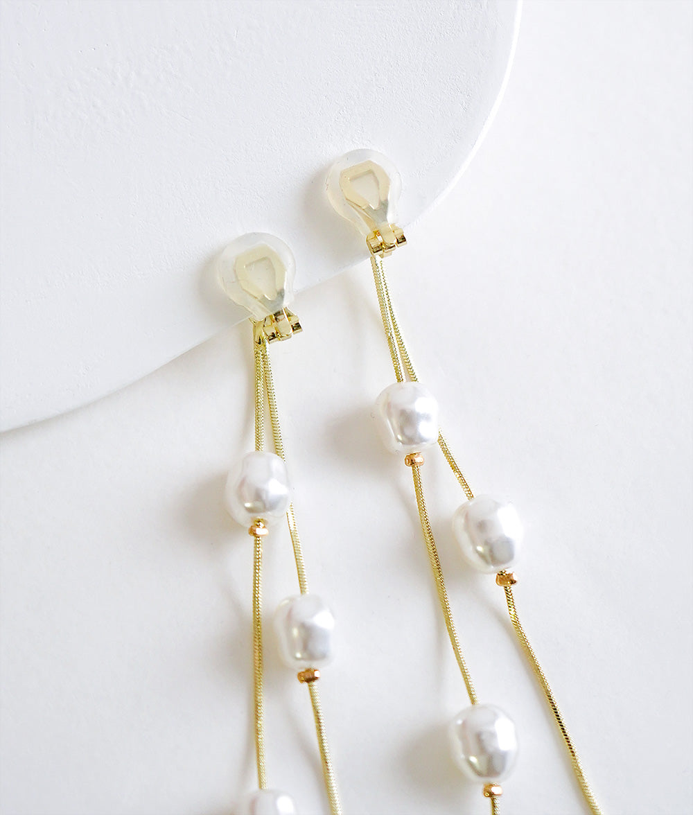 Dangling pearl earrings