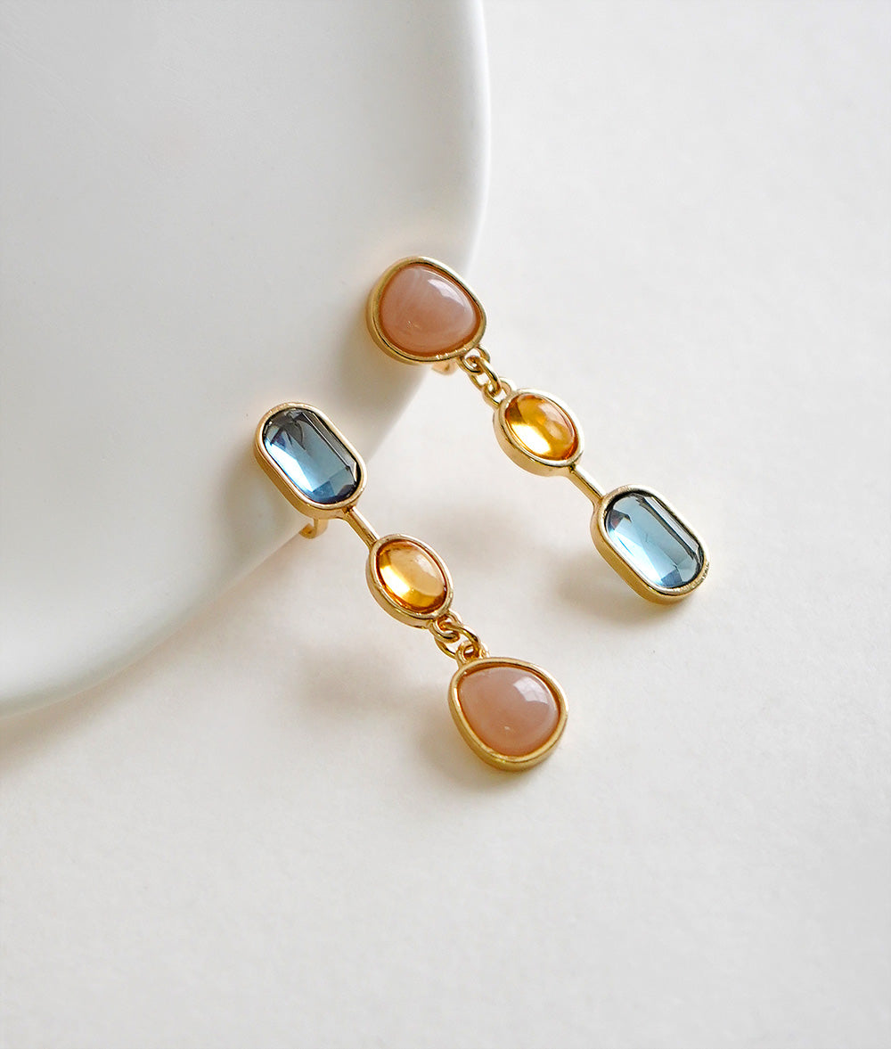 Asymmetric drop ear clip