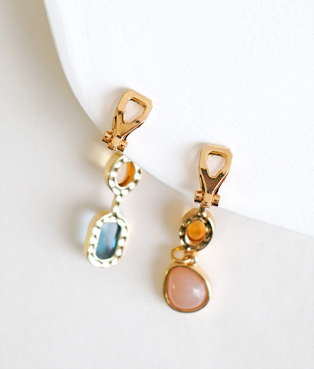 Asymmetric drop ear clip