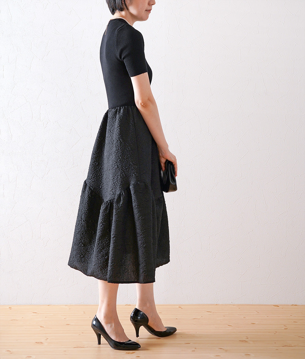 Knitted jacquard dress and pearl necklace