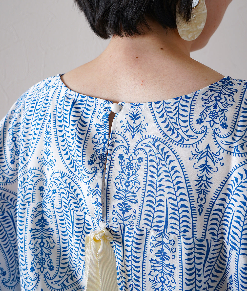 Blouse with ribbon and paisley pattern