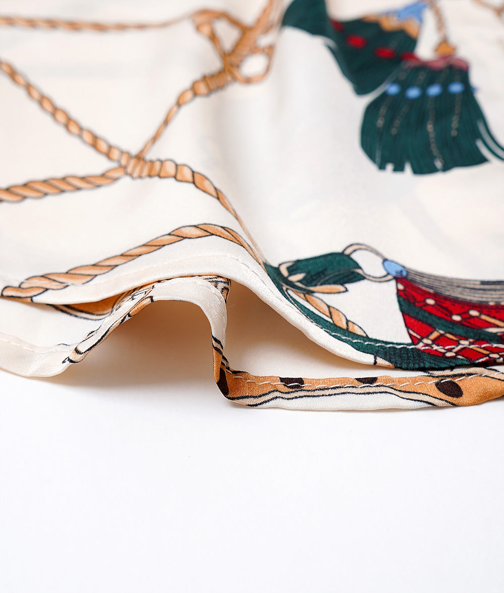 Chain pattern bow tie blouse