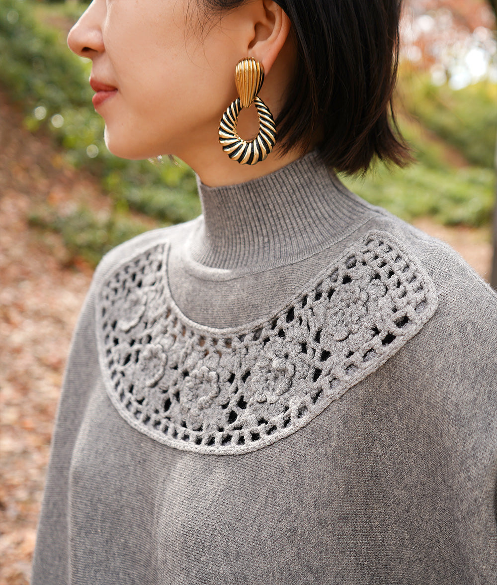 Glittering studs and crochet dolman knit