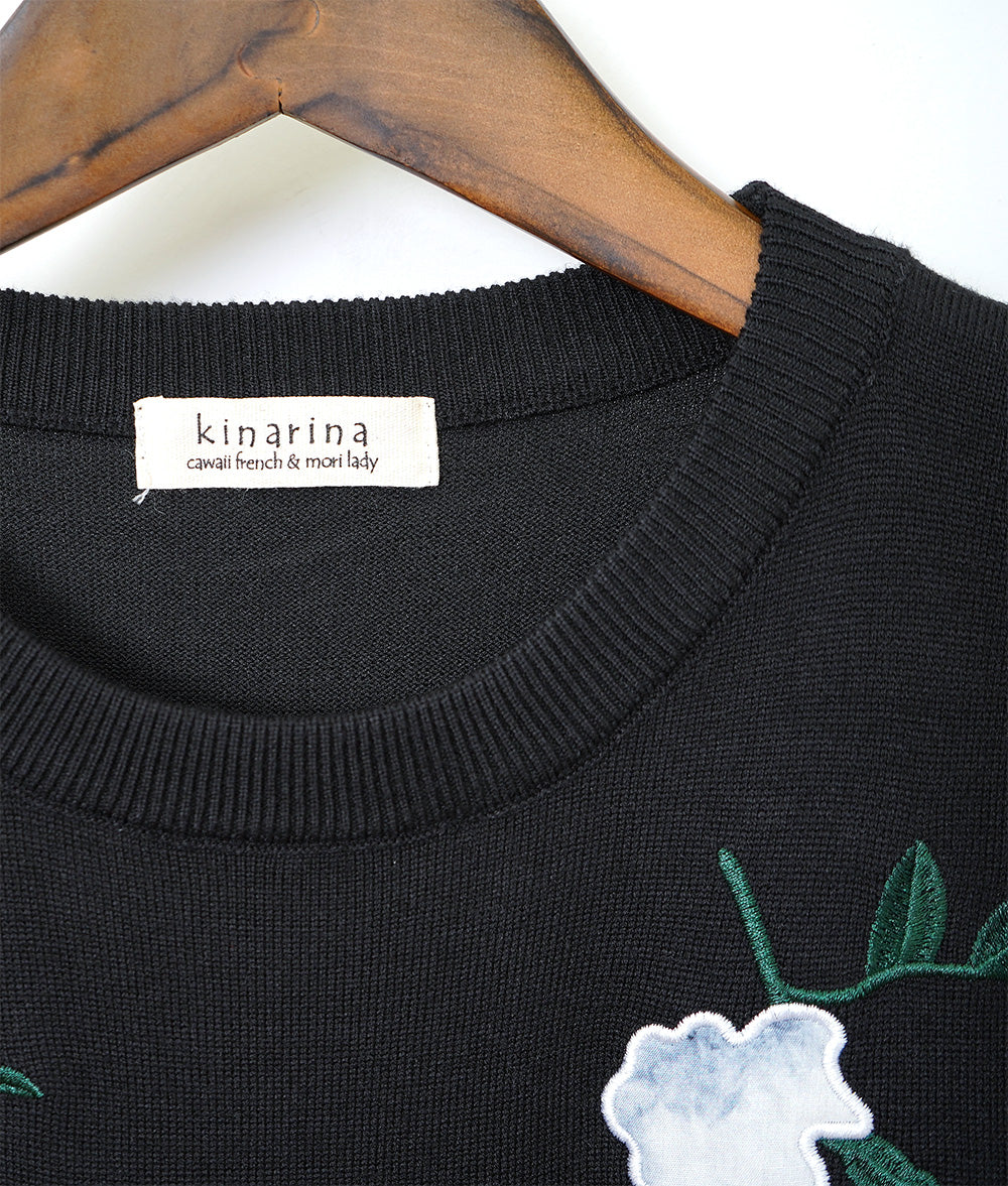 Black one-piece dress with lovely fragile flowers and embroidered flowers