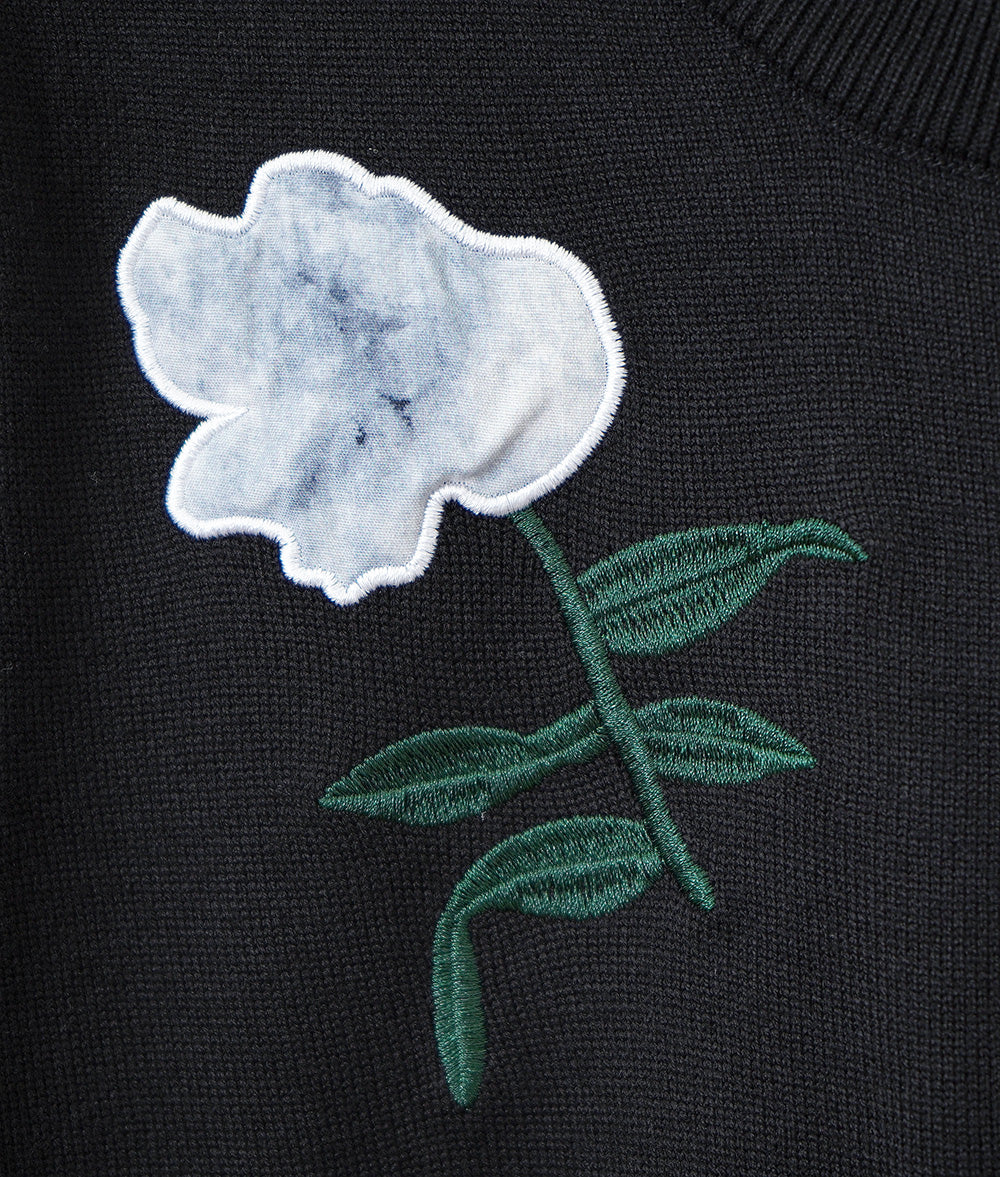 Black one-piece dress with lovely fragile flowers and embroidered flowers