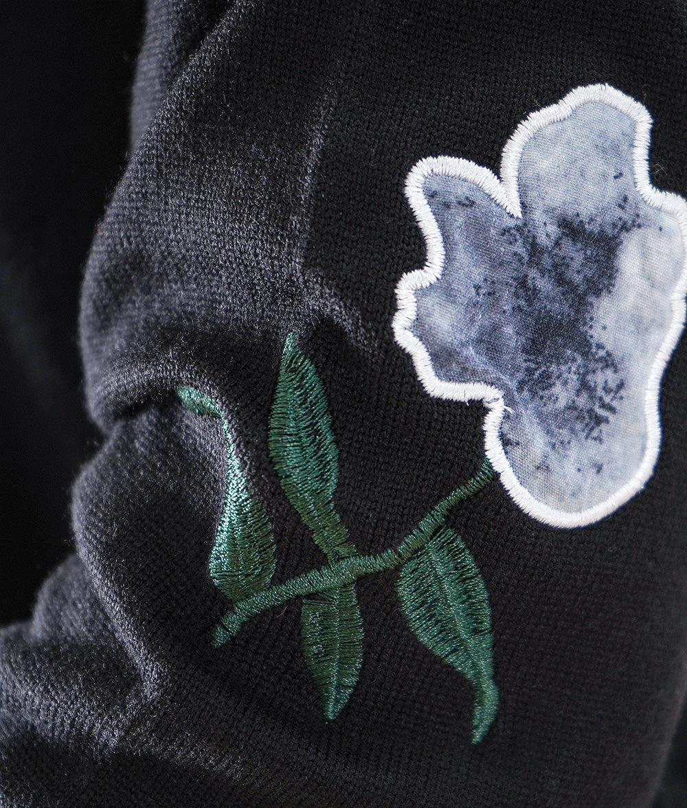 Black one-piece dress with lovely fragile flowers and embroidered flowers