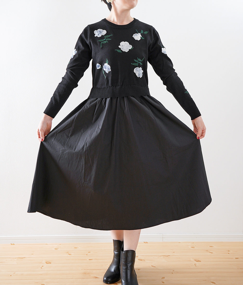 Black one-piece dress with lovely fragile flowers and embroidered flowers