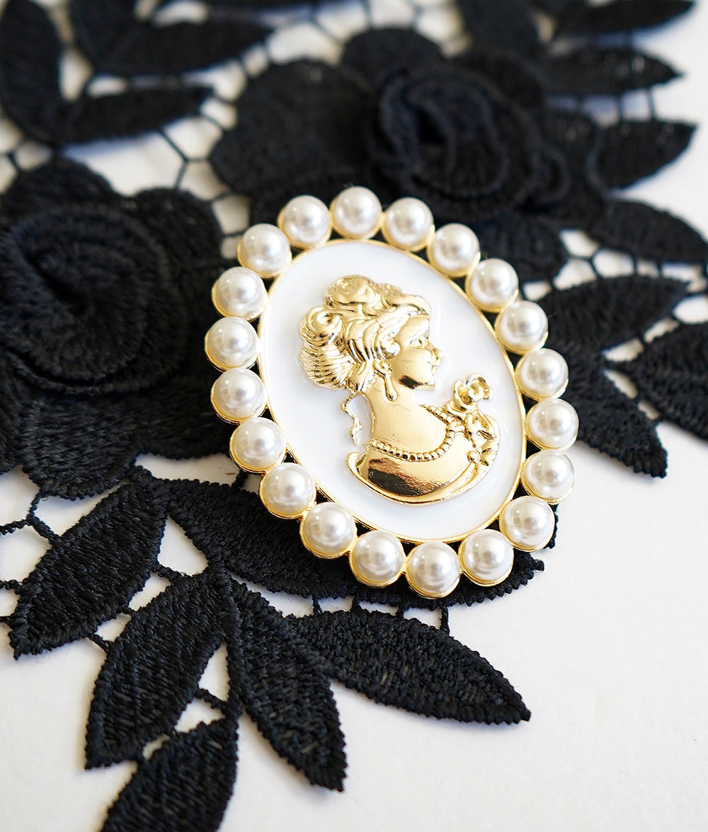 Cameo style pearl brooch