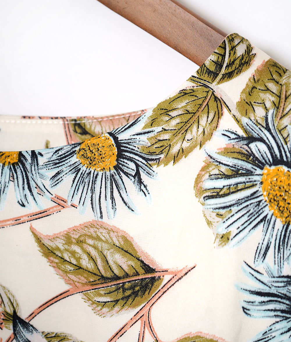 A soft, thick blouse with a simple flower that gently shines