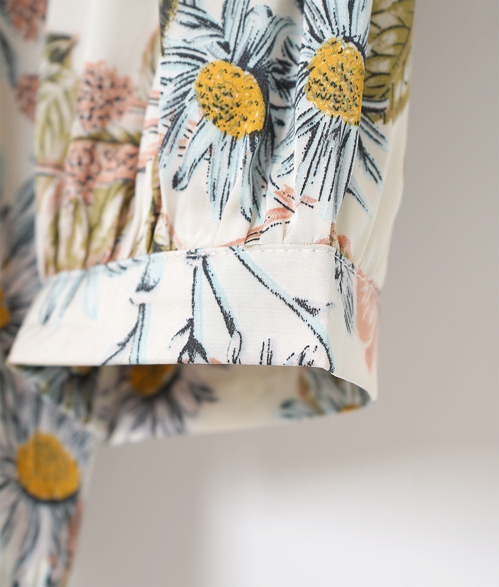 A soft, thick blouse with a simple flower that gently shines