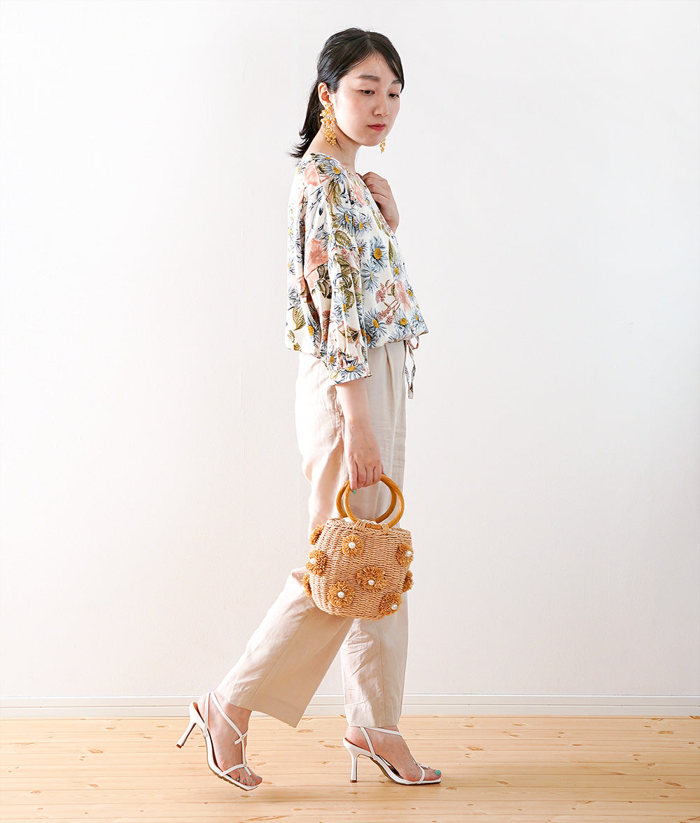 A soft, thick blouse with a simple flower that gently shines