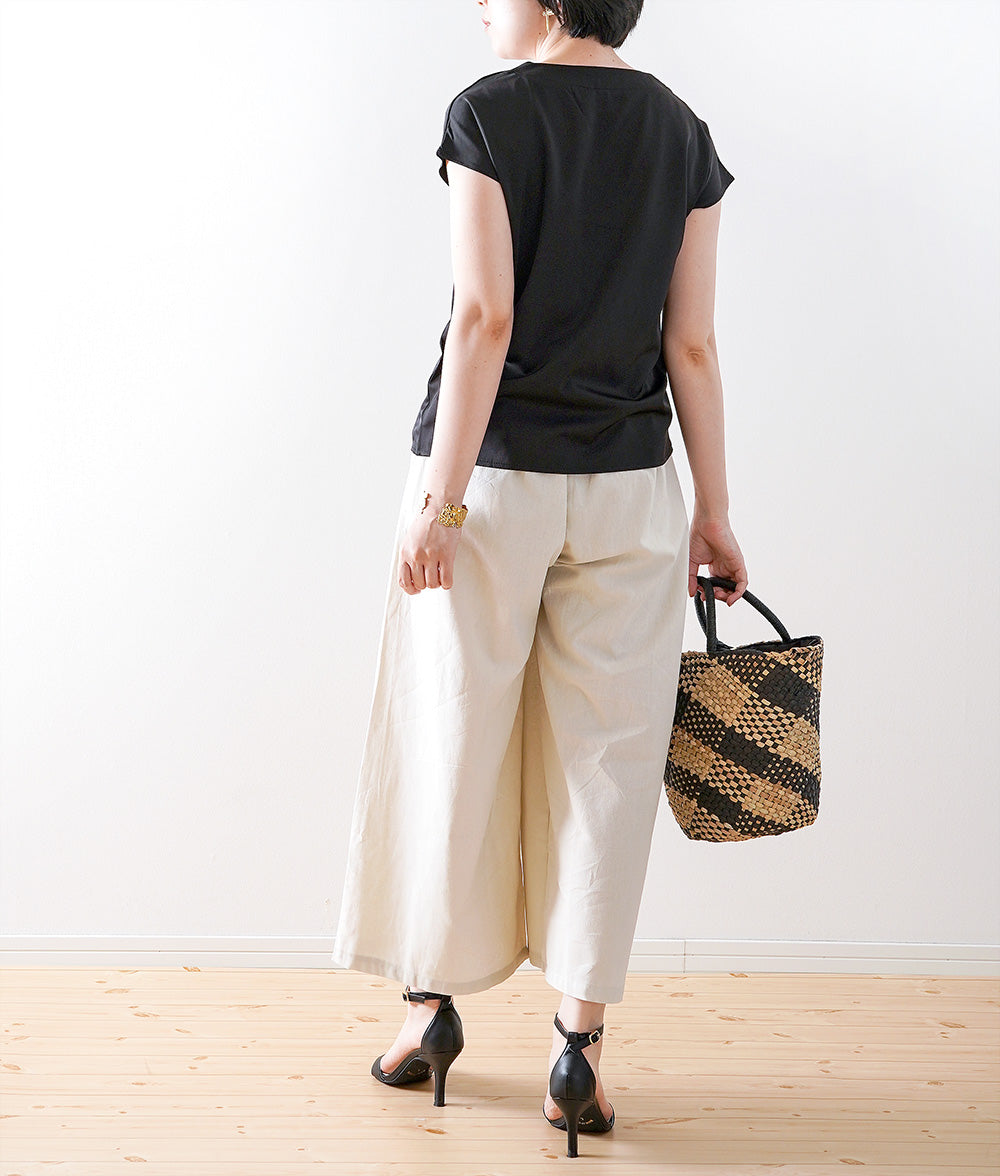 Glossy blouse with embroidery and cross lines