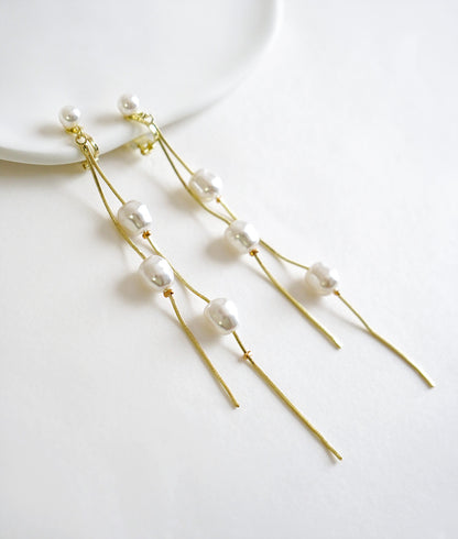 Dangling pearl earrings