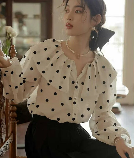 Ruffled collar and polka dot blouse