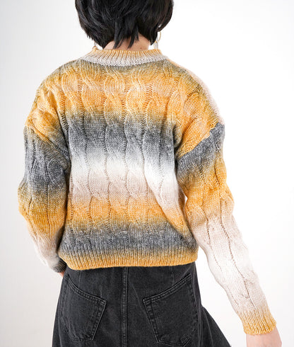 Bleed color cable knit