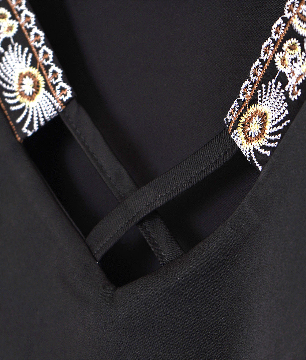 Glossy blouse with embroidery and cross lines