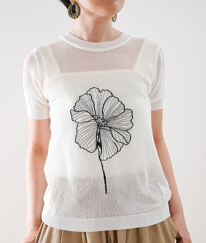 Summer knit in which a single flower blooms